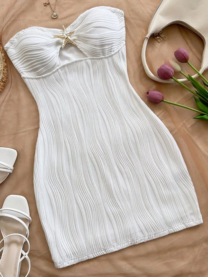 A sexy, pure and sensual, slimming, strapless and body-hugging dress