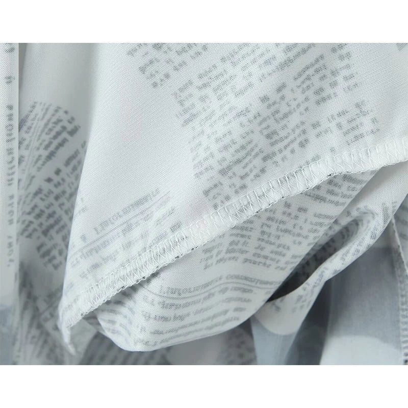 YENKYE New Women Newspaper Letter Print Irregular Hem Sling Dresses Fashion Backless Thin Straps With Chain Summer Sexy Dress