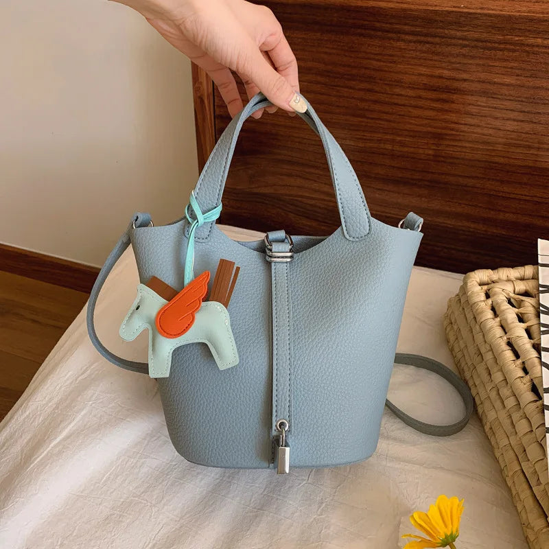 Popular and popular lychee patterned mother and child bucket bag for women, 2025 new casual retro handbag, casual commuting bag