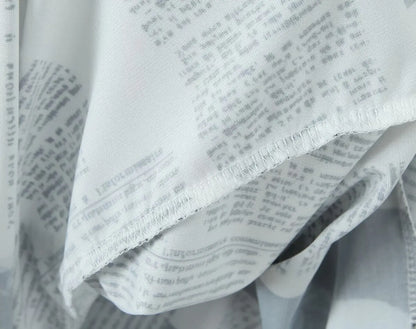 YENKYE New Women Newspaper Letter Print Irregular Hem Sling Dresses Fashion Backless Thin Straps With Chain Summer Sexy Dress