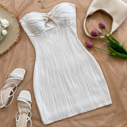 A sexy, pure and sensual, slimming, strapless and body-hugging dress