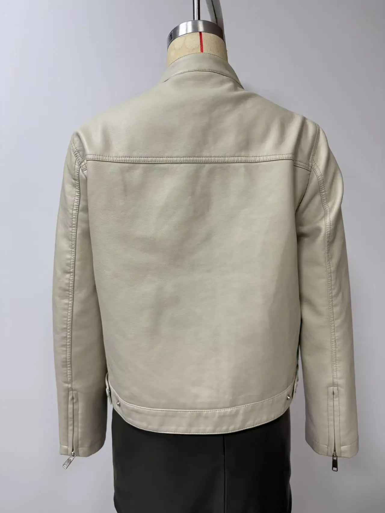 Black Women's Fitted Leather Jacket with Front Zipper & Side Pockets‌, Available in Brown, Navy Blue, and Beige.