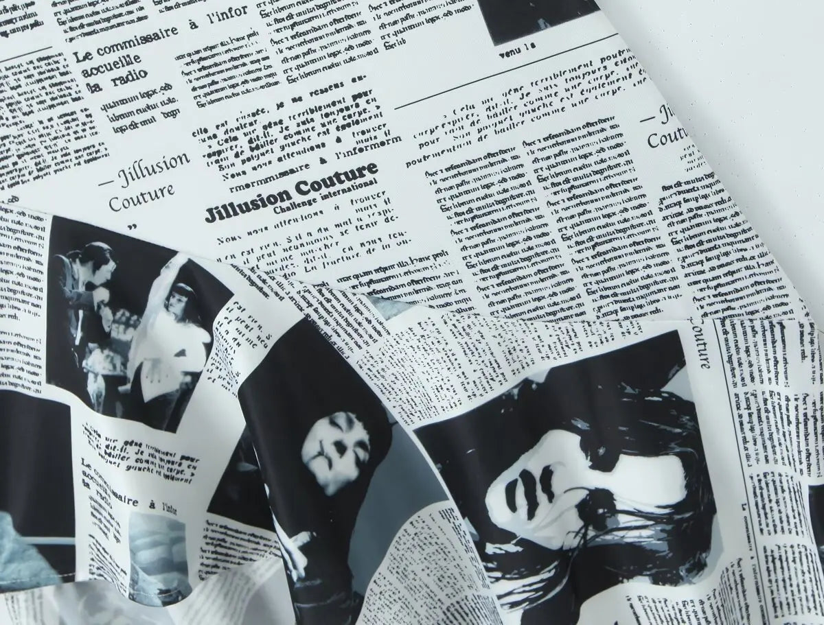 YENKYE New Women Newspaper Letter Print Irregular Hem Sling Dresses Fashion Backless Thin Straps With Chain Summer Sexy Dress