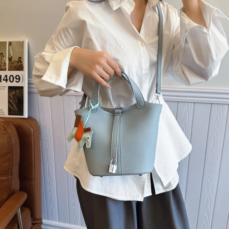 Popular and popular lychee patterned mother and child bucket bag for women, 2025 new casual retro handbag, casual commuting bag