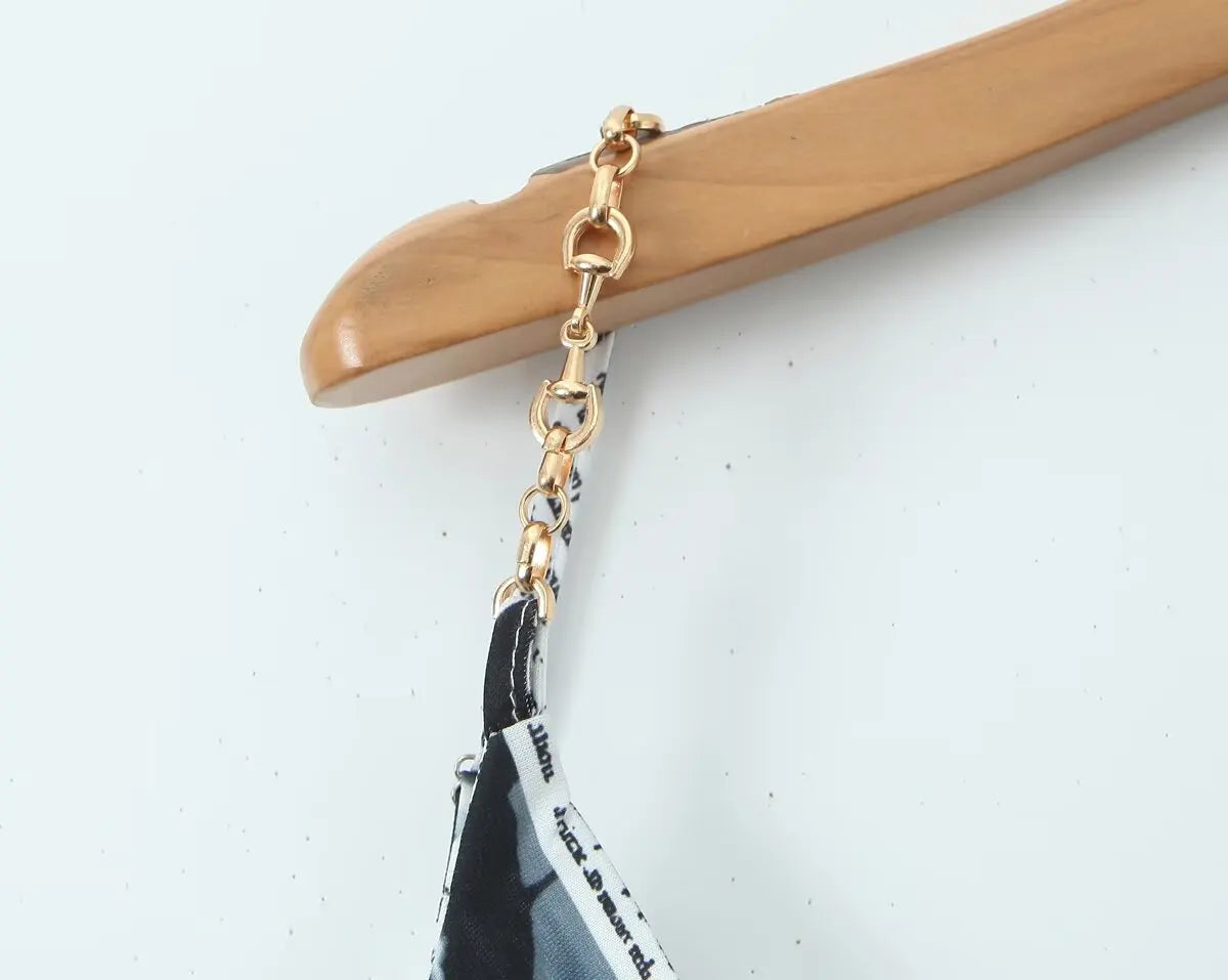 YENKYE New Women Newspaper Letter Print Irregular Hem Sling Dresses Fashion Backless Thin Straps With Chain Summer Sexy Dress