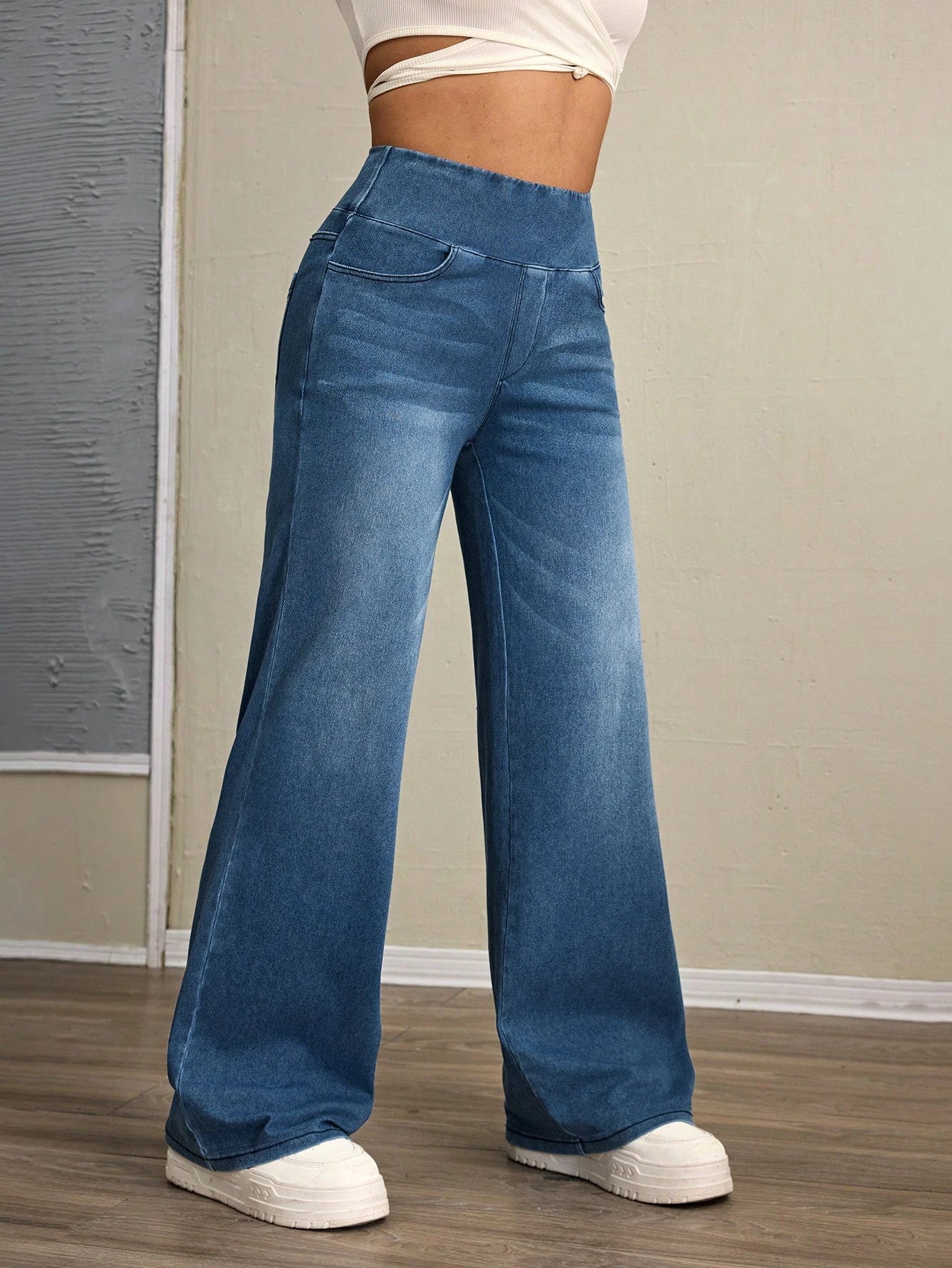 Women's high-rise wide-leg jeans with tummy tuck, slim fit, made from stretch denim fabric, are stylish for casual everyday wear