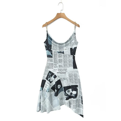 YENKYE New Women Newspaper Letter Print Irregular Hem Sling Dresses Fashion Backless Thin Straps With Chain Summer Sexy Dress