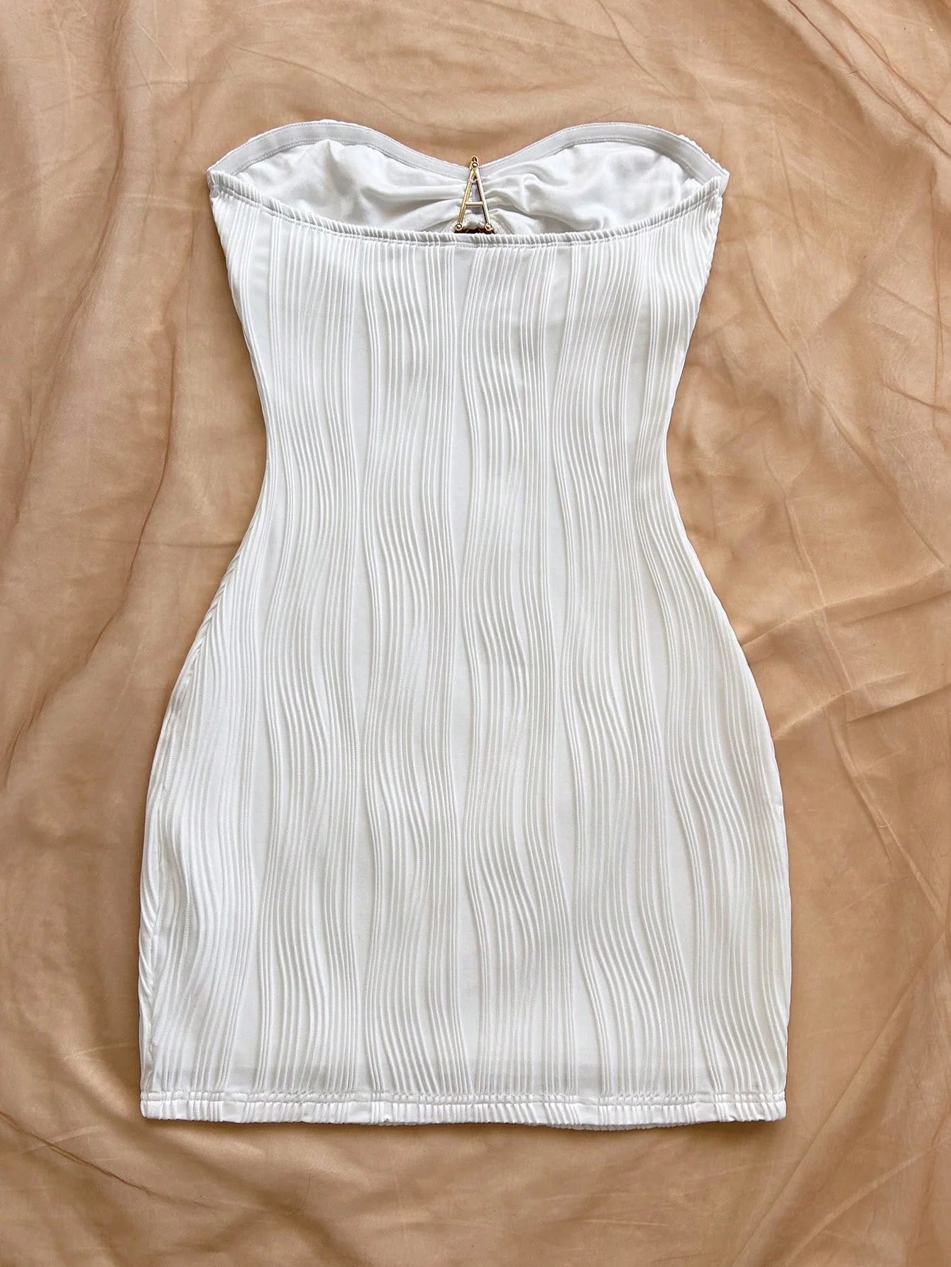 A sexy, pure and sensual, slimming, strapless and body-hugging dress