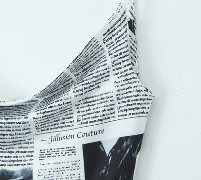 YENKYE New Women Newspaper Letter Print Irregular Hem Sling Dresses Fashion Backless Thin Straps With Chain Summer Sexy Dress