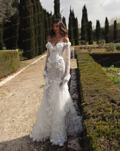 Graceful White Wedding Dress Features Floral Embellishments Long Sleeves With Deep V Neckline Flowing Fabric Creates Graceful