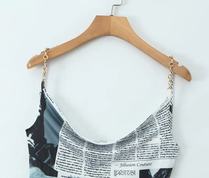YENKYE New Women Newspaper Letter Print Irregular Hem Sling Dresses Fashion Backless Thin Straps With Chain Summer Sexy Dress